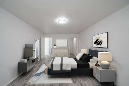 A modern bedroom with a large bed and a television. at Red Bay Apartment Complex, Jacksonville, FL, 32211