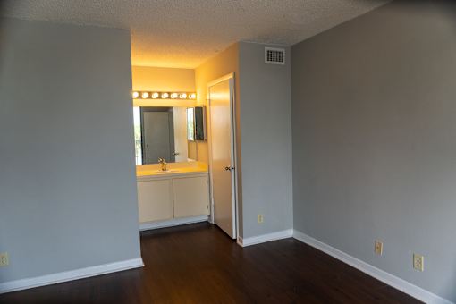 an empty living room with a sink and a mirror at Bella Lago Vista, West Palm Beach