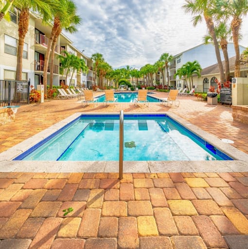 a swimming pool is next to a resort style pool at Bella Lago Vista, West Palm Beach, 33401
