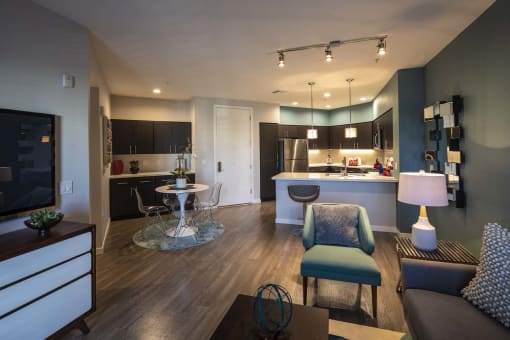a kitchen and living room in a 555 waverly unit