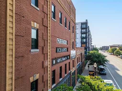 A street view of a red brick building with the sign "ICE LOFFS" on it.