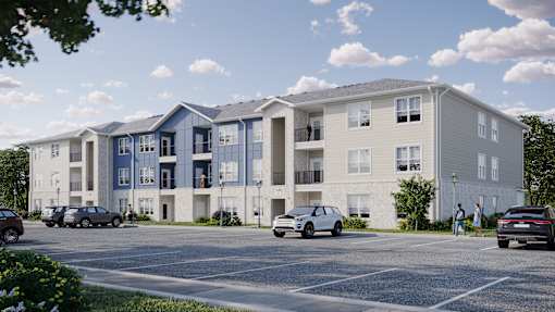 A row of modern apartment buildings with cars parked in front.