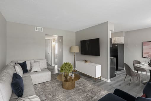 a living room with gray walls and a white couch