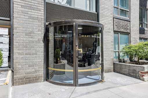 A glass door with a yellow line on the bottom of it.