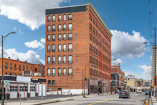 A large red brick building sits on a street corner at 206 Flats Apartments, Spokane