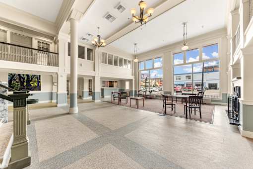 A large open space with tables and chairs and a balcony at 206 Flats Apartments, Spokane, WA, 99201