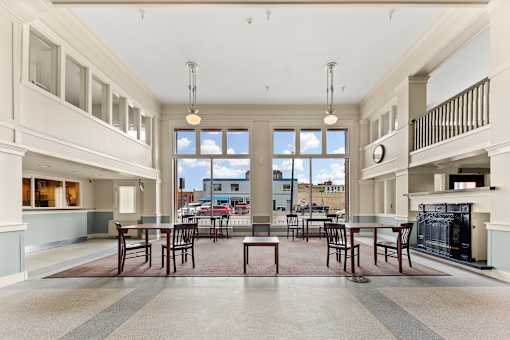 A large open kitchen and dining room with a fireplace and a view of the outdoors at 206 Flats Apartments, Spokane, WA