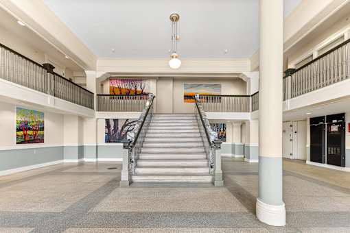 A staircase in a building with a large painting on the wall at 206 Flats Apartments, Spokane, WA, 99201