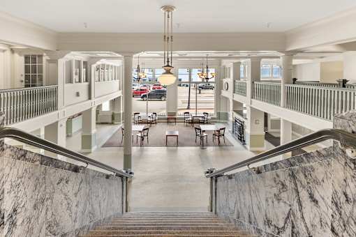 A large atrium with a staircase leading to the second floor at 206 Flats Apartments, Spokane, Washington