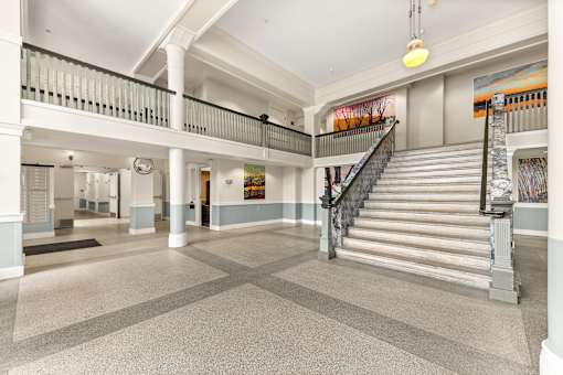 A large open space with a staircase and a painting on the wall at 206 Flats Apartments, Spokane, WA, 99201