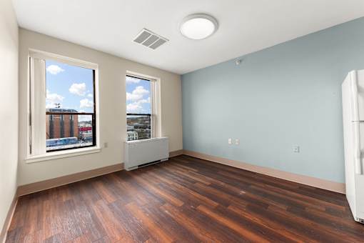 A room with wooden floors and a window at 206 Flats Apartments, Spokane, Washington