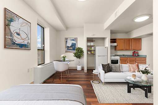 A modern living room with a grey sofa and a coffee table at 206 Flats Apartments, Spokane, Washington
