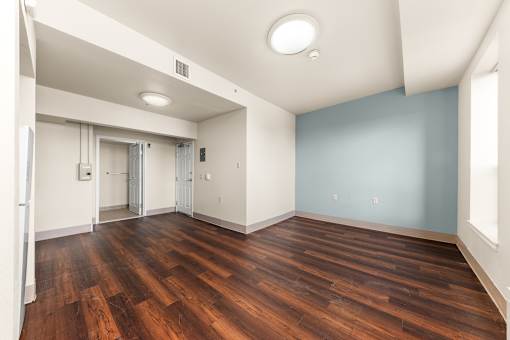 A room with wooden floors and a white ceiling. at 206 Flats Apartments, Washington