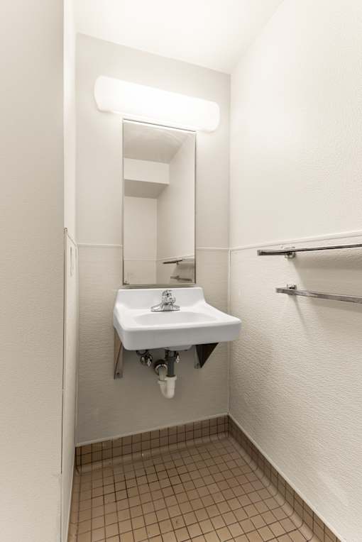 A small white sink in a small bathroom at 206 Flats Apartments, Spokane, WA, 99201