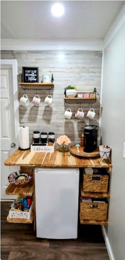 a small kitchen with a counter top and a refrigerator