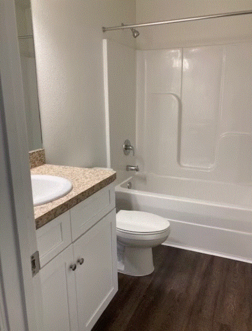 a bathroom with a toilet sink and bathtub