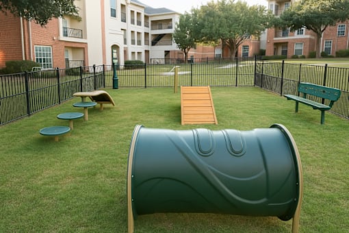 Dog park with agility equipment and obstacle course at Clearwater Creek Apartments, Richardson, TX 75082