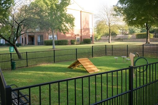 Dog park with agility equipment and obstacle course at Clearwater Creek Apartments, Texas