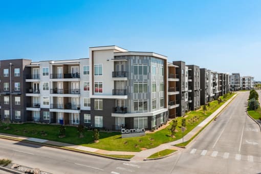 a large apartment building on the side of a street