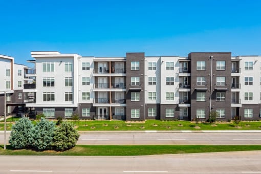 an apartment building on the side of a street