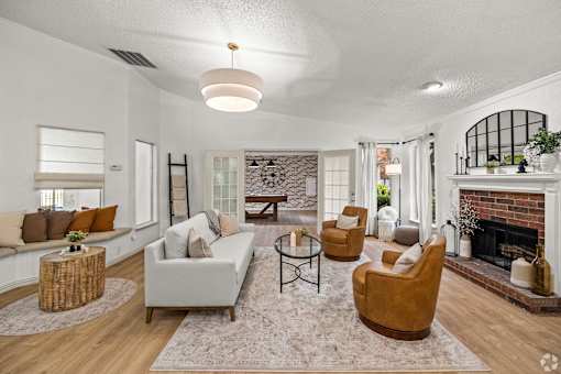 A living room with a fireplace and a couch.