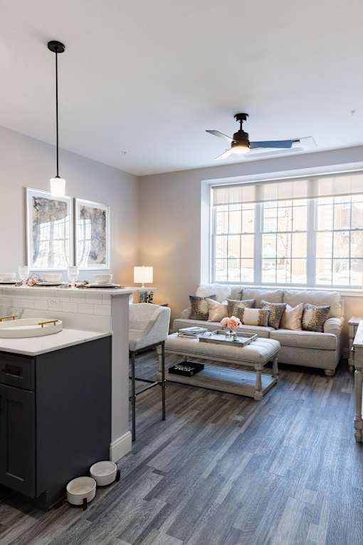 A modern bathroom with a large mirror and a sink.