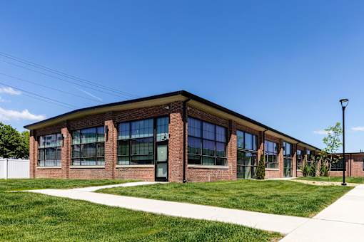 A modern building with a brick facade and large windows.