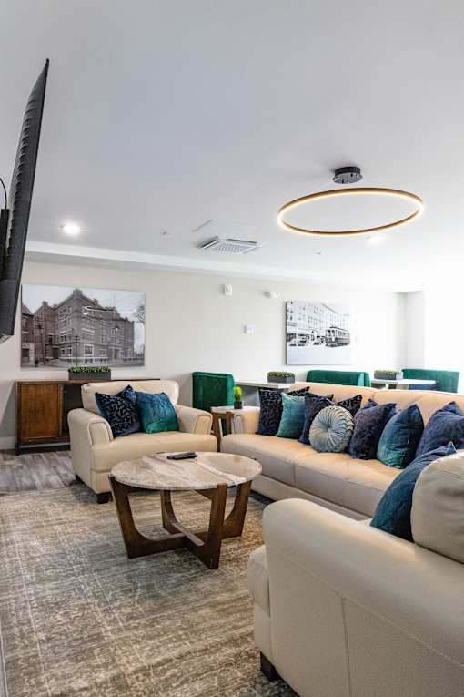A living room with a white couch and a coffee table.