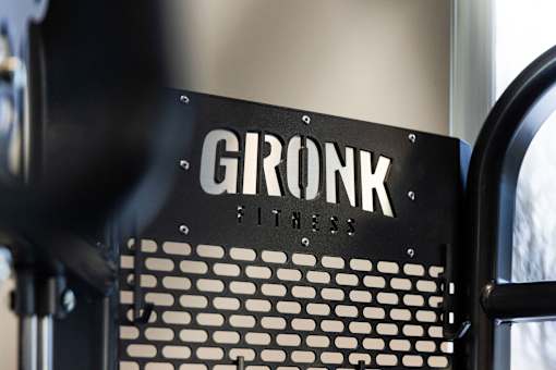 A close up of a black and white machine with the word GRONK on it.