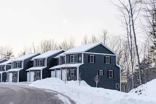 A row of houses with the number 25 on the front of the first one.