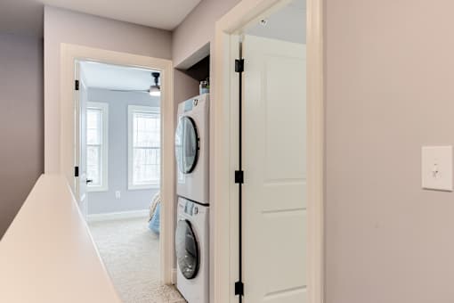 A laundry room with a washer and dryer in it.