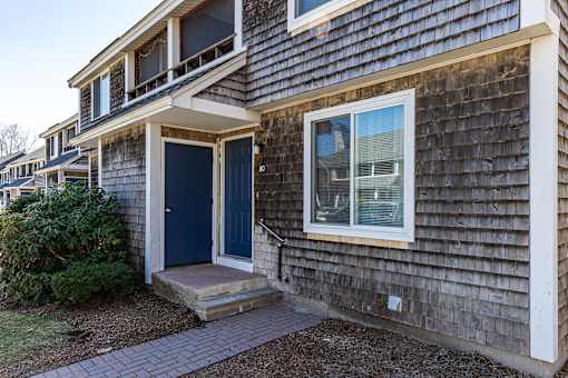 A house with a blue door and a window.