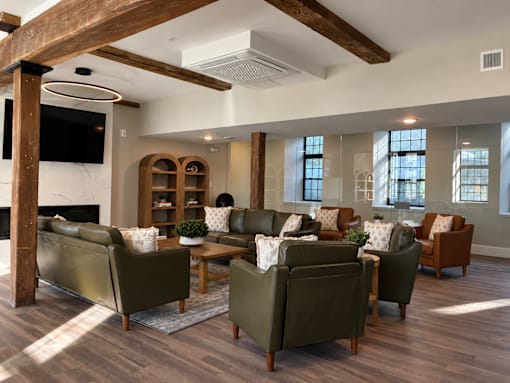 A living room with a fireplace and a television.