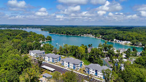 arial view of apartments with a lake in the background