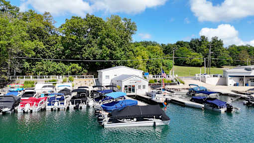 boats are docked at a marina on the water