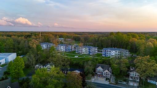 A bird's eye view of a residential area with houses and trees.