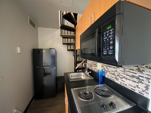 a kitchen with a stove and a microwave