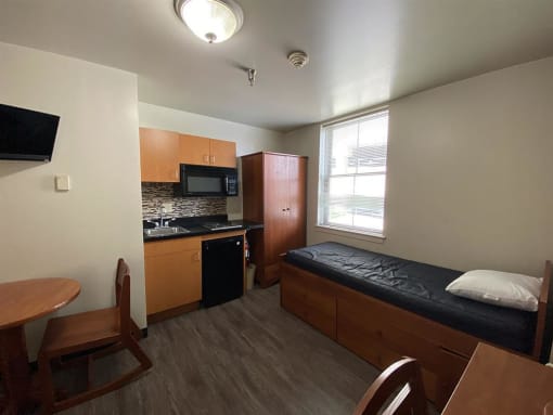 a small room with a table and a couch