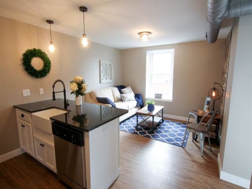 a living room with a kitchen and a couch