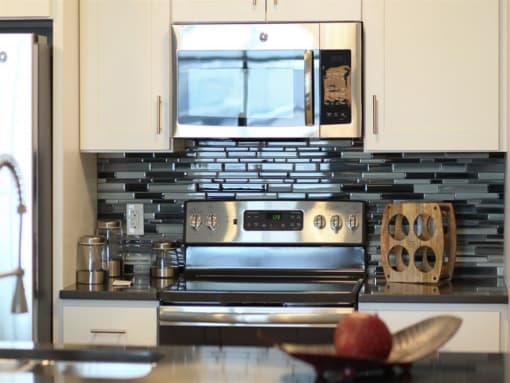 a kitchen with a stove and a microwave
