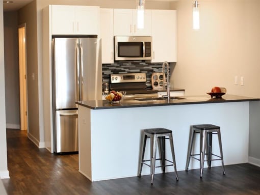 a kitchen with a counter top and a refrigerator