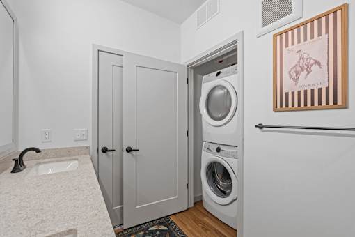 A laundry room with a washer and dryer in it.