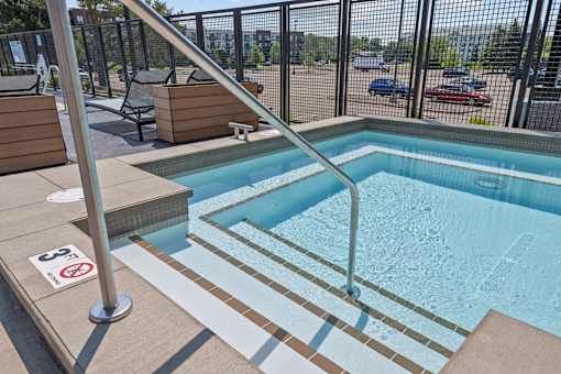 A pool with a no swimming sign on the floor.