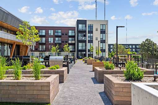 A modern building with a courtyard in front.