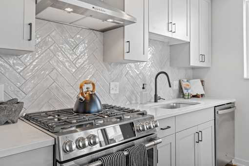 a kitchen with a stove and a sink