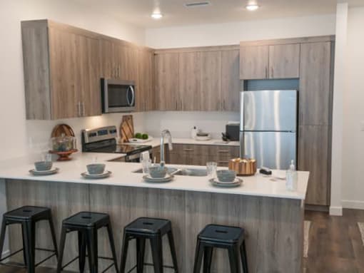 Kitchen With Island Dining at Foothill Lofts Apartments & Townhomes, Utah