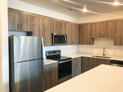Fully Equipped Kitchen With Modern Appliances at Foothill Lofts Apartments & Townhomes, Logan, Utah