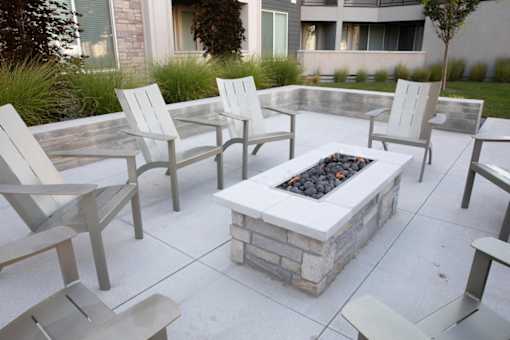 Fire pit and chair at Parc on 5th Apartments & Townhomes
