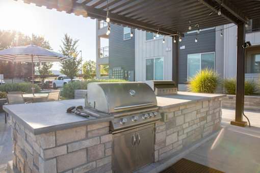 Outdoor grilling are at Parc on 5th Apartments & Townhomes