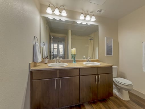 Spa-like Primary Bathroom with Double Sinks at Avena Apartments, CO